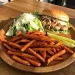 Chicken Caesar Salad Sandwich served with fries