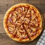 Sliced Dairy Free BBQ Chicken Pizza served with salad