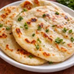Cottage cheese flatbread baked until golden and sliced on parchment paper