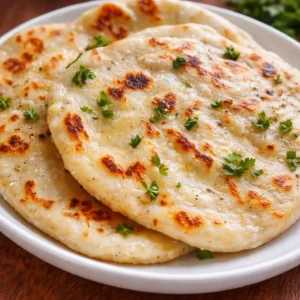 Cottage cheese flatbread baked until golden and sliced on parchment paper